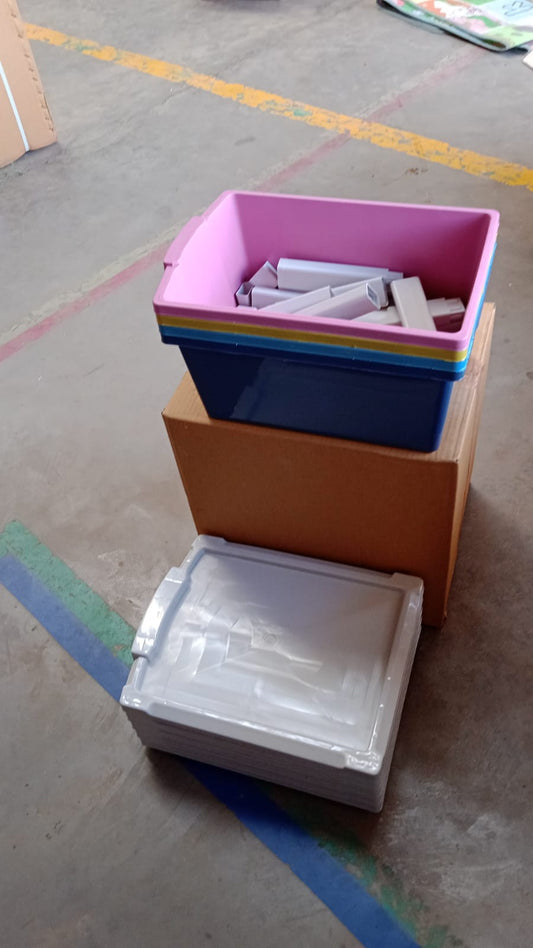 An empty plastic drawer storage unit on a white background, showcasing its clean design.