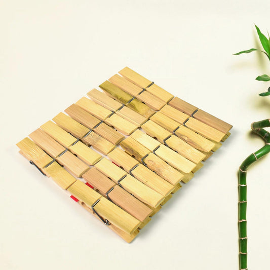 Strong bamboo cloth clips holding various garments on a clothesline, ideal for laundry.