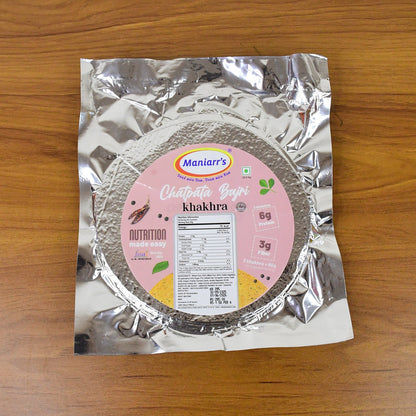 Thin, round Maniarr's Chatpata Bajri Khakhra showcasing its perfectly roasted texture.